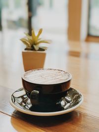 Close-up of coffee cup on table