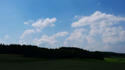 Scenic view of landscape against cloudy sky