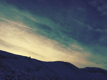 Scenic view of mountains against sky during sunset