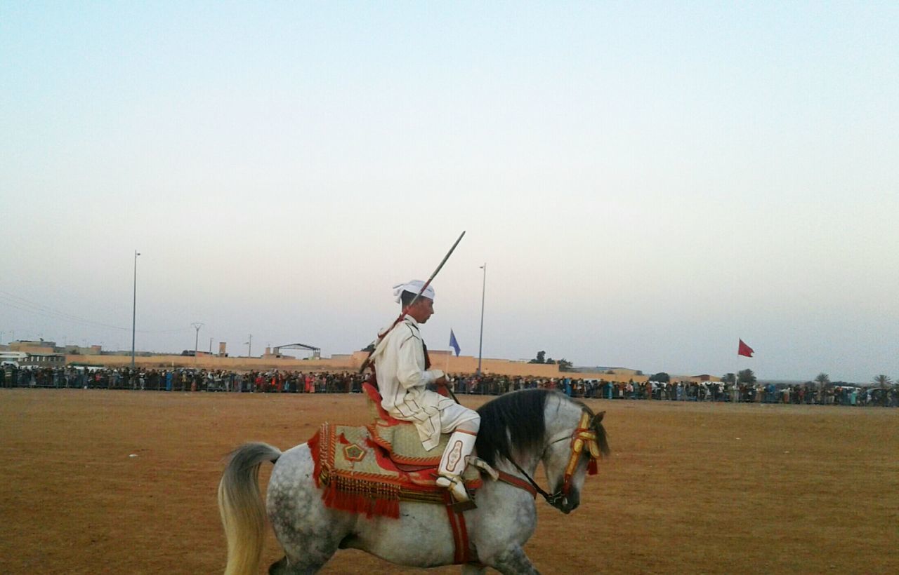 TRADITIONAL RIDING MOTORCYCLE AGAINST SKY