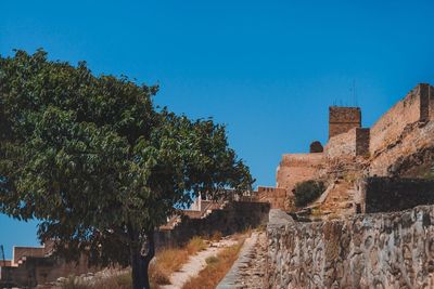 View of fort against blue sky