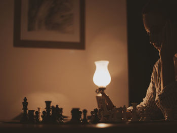 Close-up of illuminated lighting equipment on table