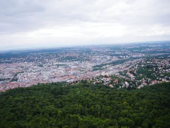 High angle view of cityscape against cloudy sky