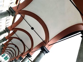 Low angle view of clock on ceiling