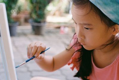 Close-up portrait of woman holding girl