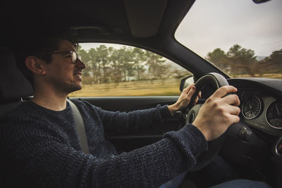 Young man in car