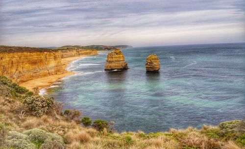 Scenic view of sea against cloudy sky