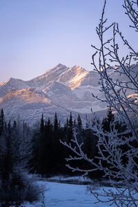 Scenic view of snowcapped mountains against sky during sunset