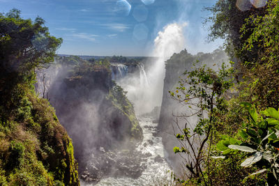 Splashing water on top of victoria falls zimbabwe