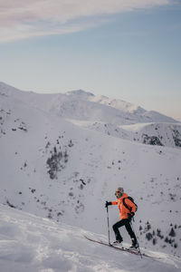 Girl skiing on snowcapped mountain