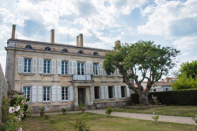 Facade of old building against sky