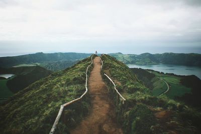 High angle view of trail on hill against sky