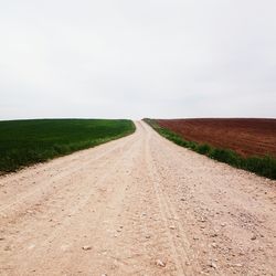 Road passing through field