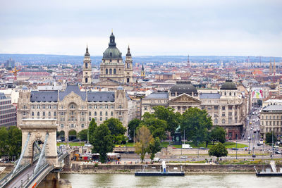 Budapest, hungary - june 22 2018 - the gresham palace and st. stephen's basilica by the danube.