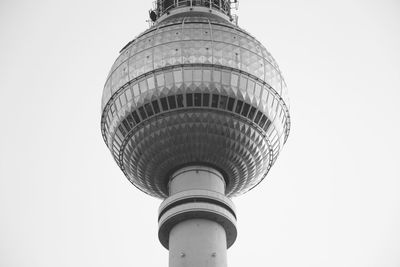Low angle view of communications tower against sky