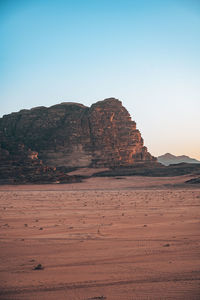 Scenic view of desert against clear sky