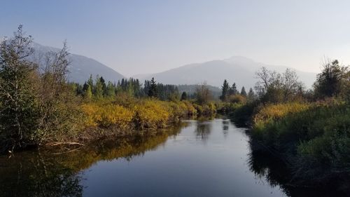 Scenic view of lake against sky during autumn