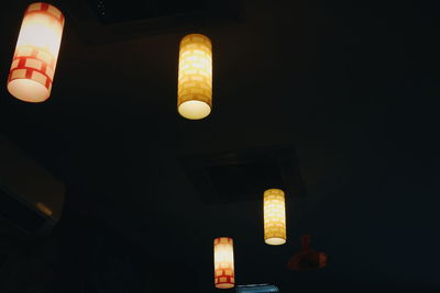 Low angle view of lamp post at night