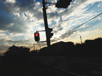 Low angle view of road sign against sky