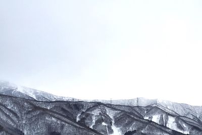 Scenic view of snow covered mountains