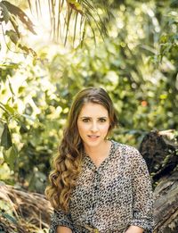 Portrait of smiling young woman standing outdoors