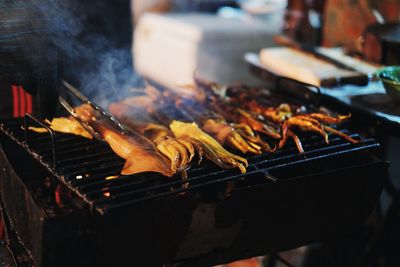 Close-up of meat on barbecue grill