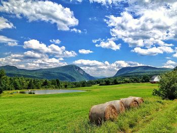 Scenic view of landscape against cloudy sky