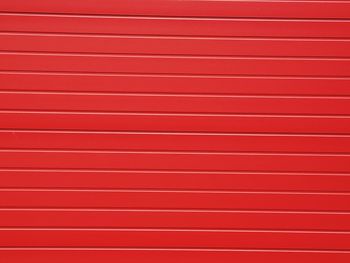 Full frame shot of red garage door