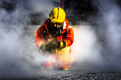 Firefighter holding water hose