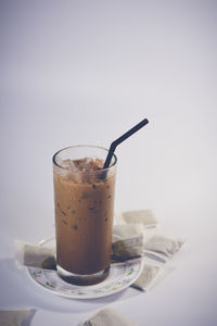 Close-up of coffee on table against white background