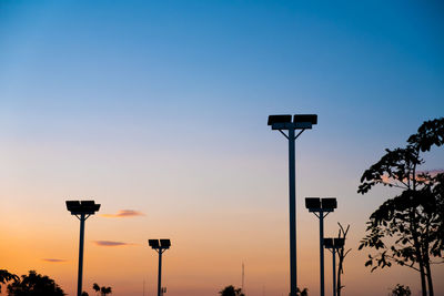 Street light against sky at sunset