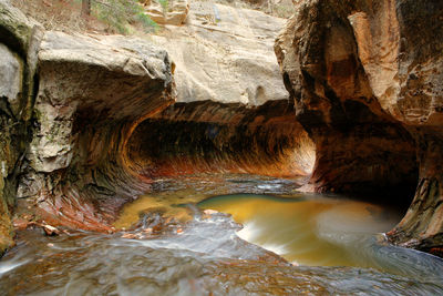 Close-up of stream flowing through rocks