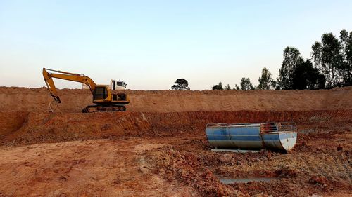 Construction site on field against clear sky