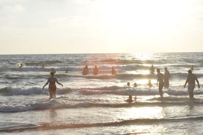 People enjoying at beach