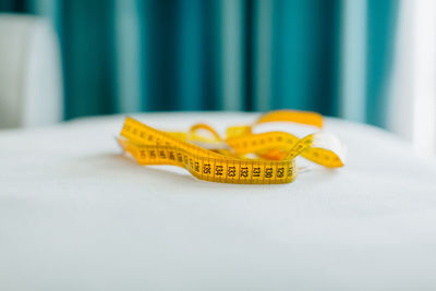 Close-up of yellow birthday cake on table