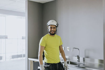 Male worker in kitchen