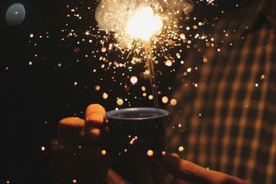 Low angle view of lit lights at night