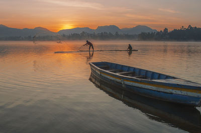 Scenic view of lake against sky during sunset