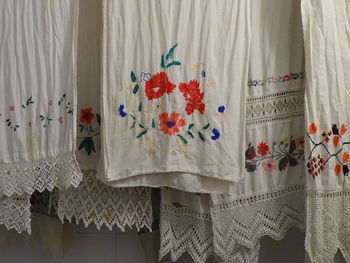 Close-up of white curtain hanging at home