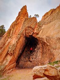 Full length of woman standing in cave