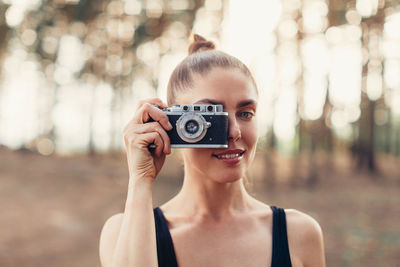 Portrait of woman photographing