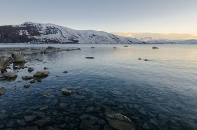 Scenic view of frozen lake against sky