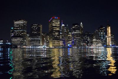 Illuminated modern buildings in city at night