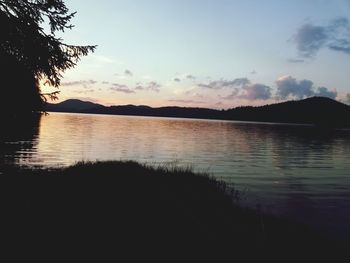 Scenic view of lake at sunset