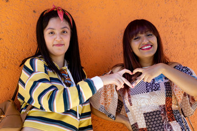 Portrait of cheerful women with straight hair and casual 