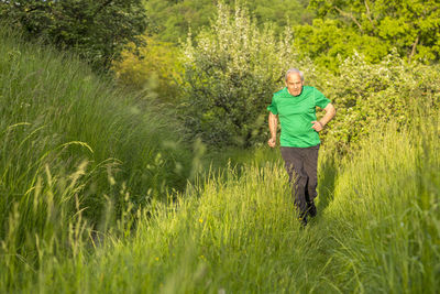 Senior man jogging in nature