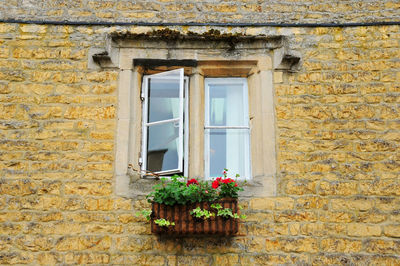 Photo of a window on a brick wall