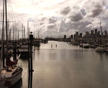 Boats moored at harbor