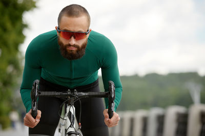 Young man riding bicycle