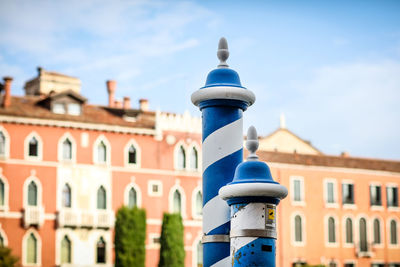 Close-up of building against blue sky